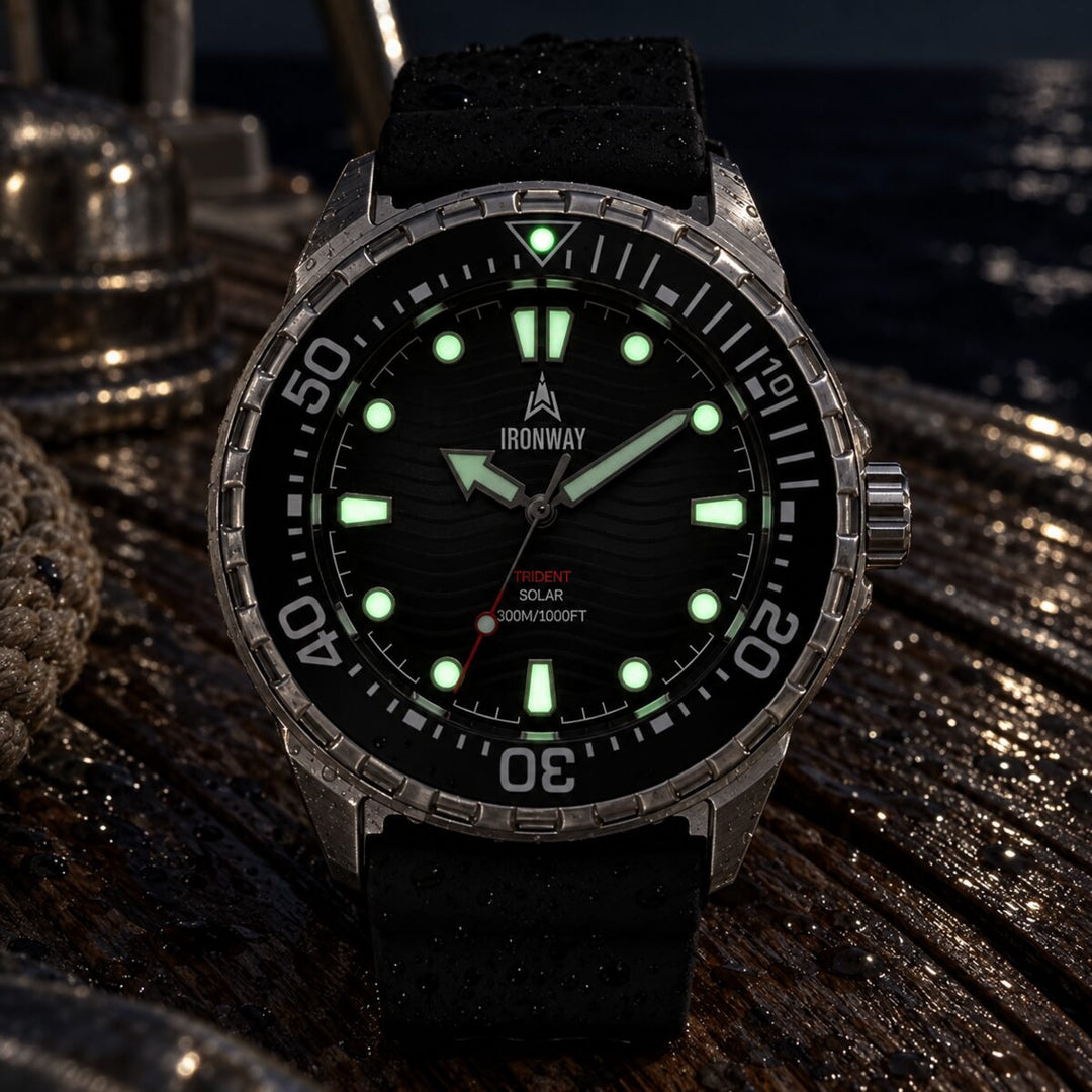 Trident 300 with the hands and markers glowing green at night on a boat